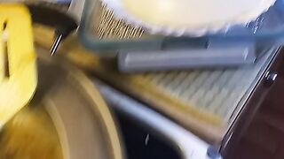 Cooking food in kitchen.
