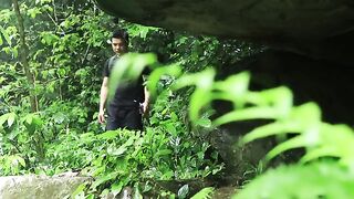 "Crafting a Cozy Refuge: Transforming a Giant Rock into a Rainforest Shelter"