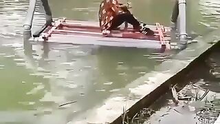 Schoolboy riding a boat falls into the water