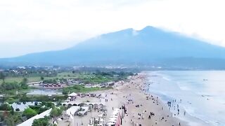 A beach tourist attraction in Lampung with a backdrop of mountains and the open sea and equipped with various facilities to pamper yourself