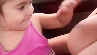 Funny Kid Playing with Mom's Milk Pack