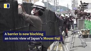 Japanese town erects barrier blocking iconic view of Mount Fuji