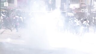 Kenyan protesters clash with police in nationwide riot.