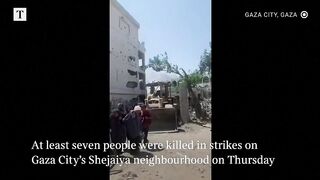Palestinians run for cover as Israeli forces hit Gaza City.