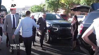 Alec Baldwin arrives at court with wife and baby.