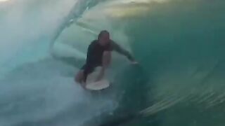 Foreign tourists are surfing beautiful waves in the sea on the west coast of Lampung