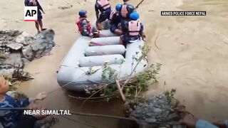Two buses carrying at least 60 people swept into a river by a landslide in Nepal. 3 survivors found.