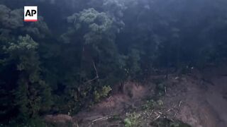 Three reported missing after landslide in western Japan.