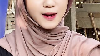 beautiful hijab-wearing woman playing tik tok 11
