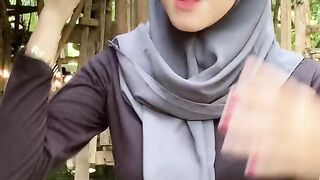 beautiful hijab-wearing woman playing tik tok 12