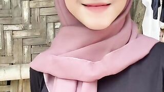 beautiful hijab-wearing woman playing tik tok 16