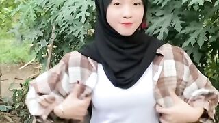 beautiful hijab-wearing woman playing tik tok 21