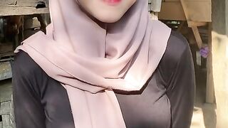 beautiful hijab-wearing woman playing tik tok 23