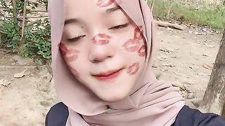 beautiful hijab-wearing woman playing tik tok 26