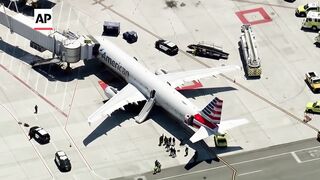Smoking laptop in passenger's bag prompts evacuation on American Airlines flight in San Francisco.