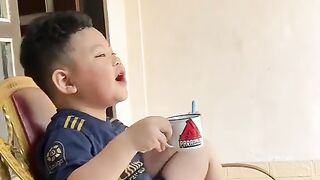 Boy learns to sing while enjoying a cup of coffee