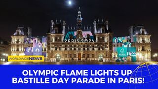 Olympic Flame Lights Up Bastille Day Parade in Paris!
