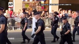 WATCH_ BTS' Jin carries Olympic torch in Paris.