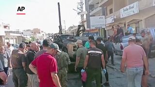 Aftermath of Israeli drone strike in Lebanon that killed militant leader.