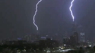 Lightning strikes Chicago skyscrapers during tornado. July 15, 2024.