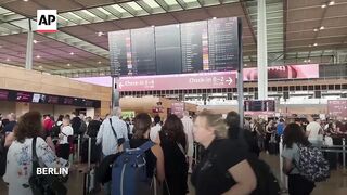 Flights delayed at Berlin airport as widespread technology outage causes disruption around world.