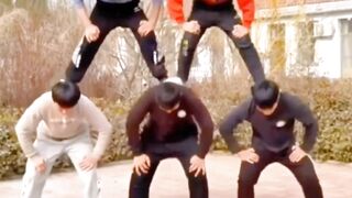 "Human Pyramid Dance: Six People in Perfect Harmony"