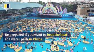 Chinese tourists flock to water park to escape heat.