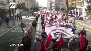 Demonstrators march in Peru to demand resignation of President Dina Boluarte.