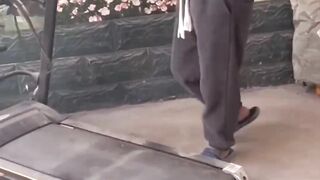 A man covers his embarrassment by doing funny actions.