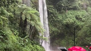 Waterfalls on the side of the highway add beauty and coolness to the morning.