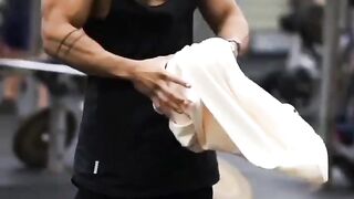 "Gym boy does a hard workout in the gym."