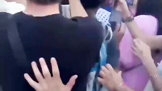 A German police decks female Palestinian