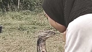 A village girl who is friends with a king cobra snake.