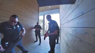 Watch how the cops react when they discover they’ve raided the wrong house
