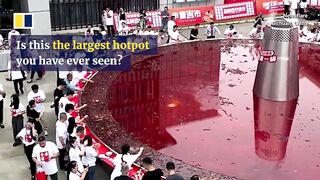 Hundreds of diners in China enjoy ‘world’s largest spicy hotpot’.