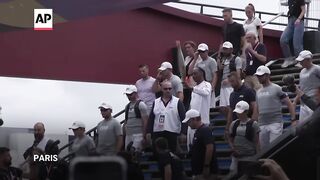 WATCH_ Snoop Dogg carries Olympic torch ahead of Paris opening ceremony.