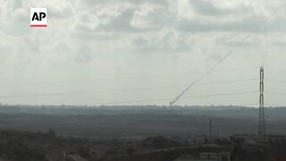 Smoke seen as rockets were fired into Israel from northern Gaza.