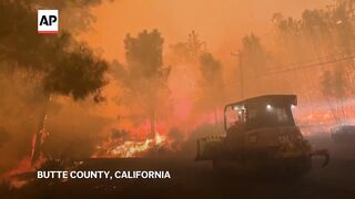 California residents flee massive wildfire sparked by burning car.