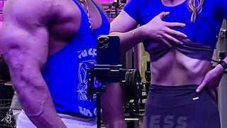 A couple is engaged in a vigorous workout at the gym.