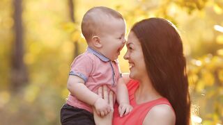 t-mother-and-son-laughing-in-the-park-33389-hd-ready.