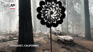 Devastation and smoke rise from the ashes of California wildfires.
