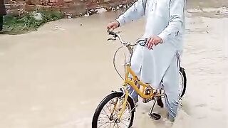 Shah Saud cycling in the flood
