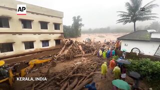 Landslides caused by heavy rains kill 49 and bury many others in southern India.
