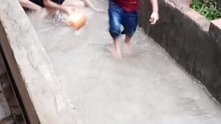 children are taking a rain shower