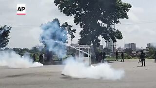 Police fire gunshots, tear gas as thousands protest the crisis in Nigeria.