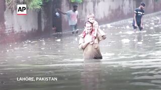 Record rainfall floods streets and affects daily life in Pakistan's Lahore.
