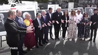IOC chief holds interfaith event outside Notre Dame cathedral.