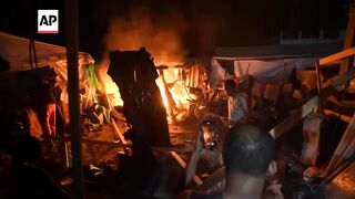 Strike hits a tent camp in Gaza's Al Aqsa Martyrs hospital courtyard.