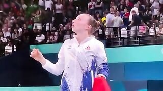 Romanian gymnast Ana Barbosu realizing that a successful protest by USA's Jordan Chiles meant that she was pushed from 3rd to 4th place
