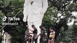 Demolishing the statue of Sheikh Mujibur Rahman.
